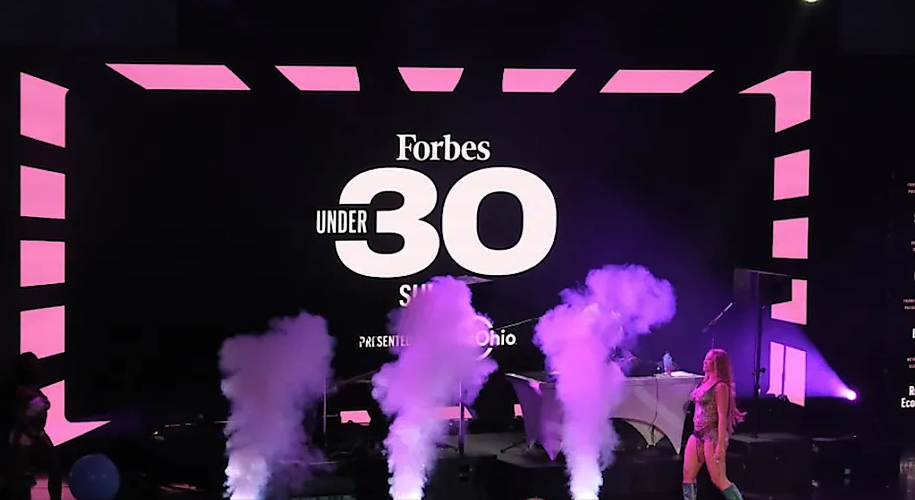 The Forbes 30 Under 30 summit stage lit up in pink