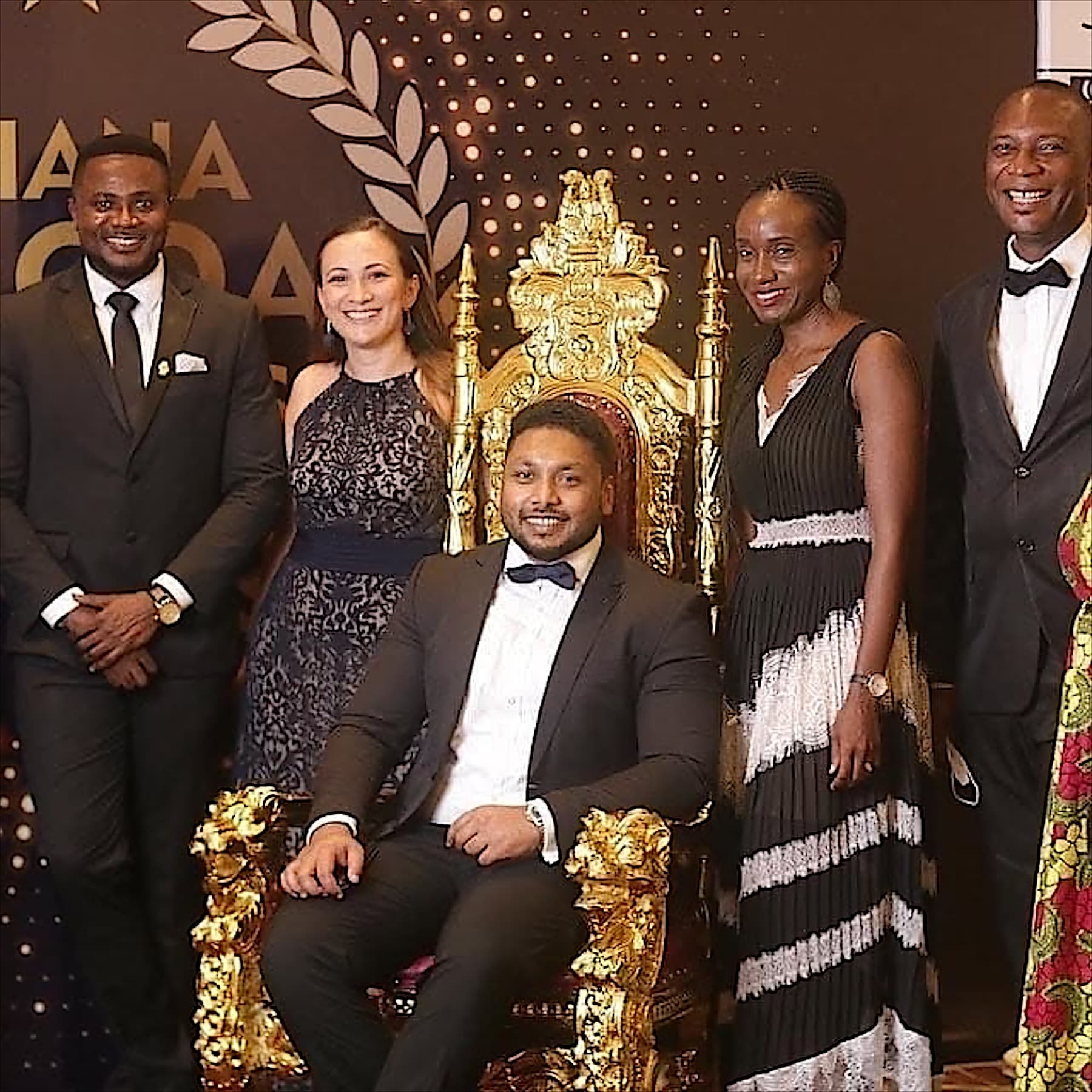 The Workspace team in evening wear at an awards gala in Ghana
