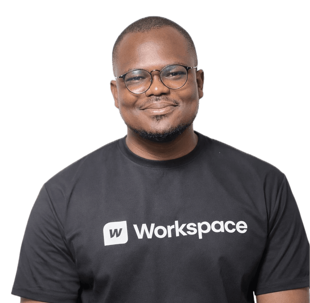 Prince Jude, UI/UX Specialist at Workspace, smiling in glasses and a Workspace T-shirt