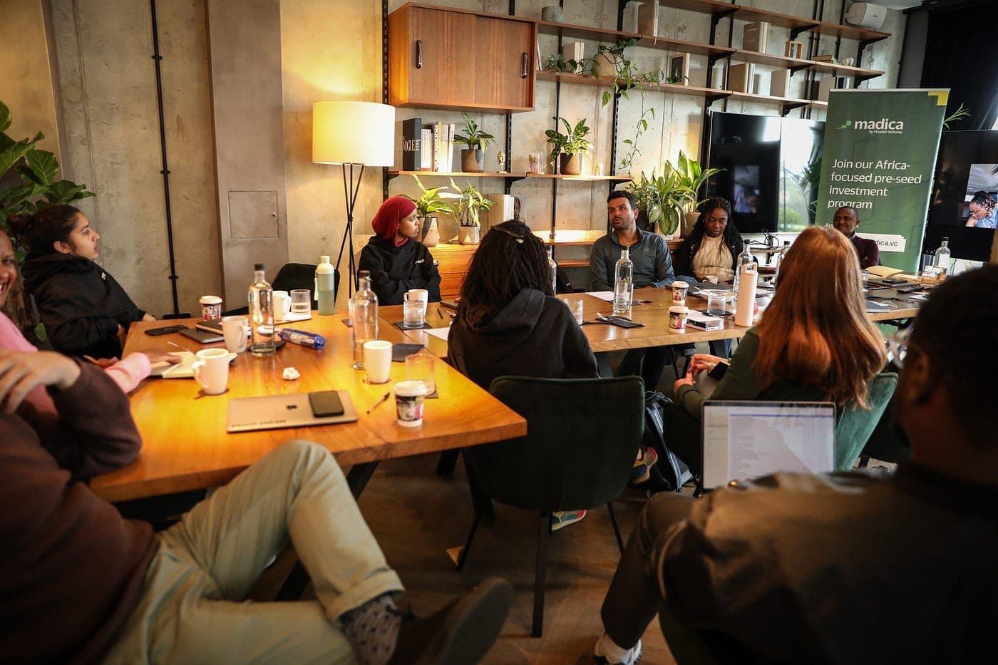 Small business owners meeting around a café table